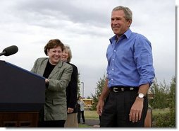 President George W. Bush is introduced by Secretary of Agriculture Ann Veneman before discussing his healthy forest initiative in Redmond, Ore., Thursday, August 21, 2003. Secretary of the interior Gale Norton is pictured in the background. White House photo by Paul Morse.